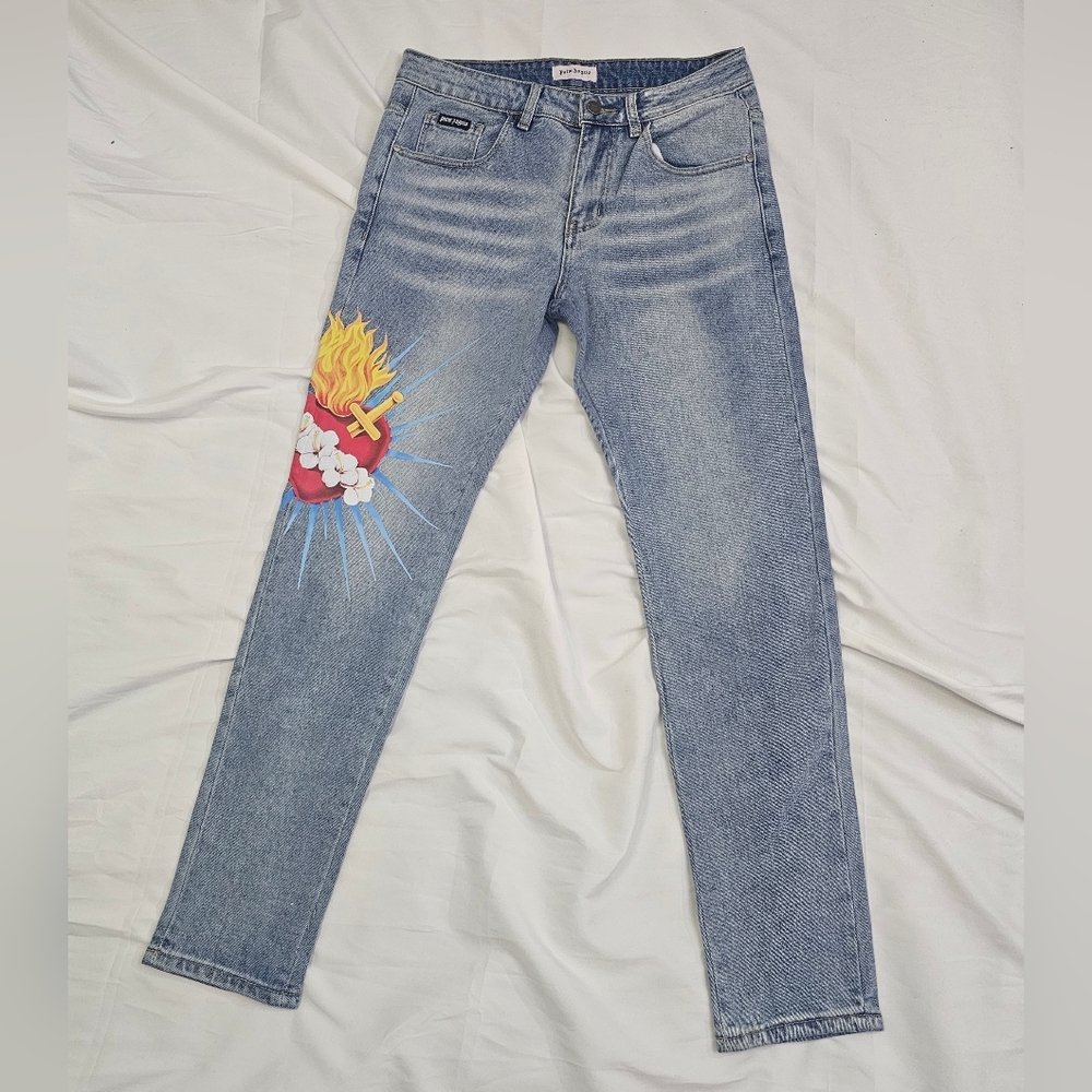 Palm Angels Light Blue Jeans with Sacred heart Graphic Detail